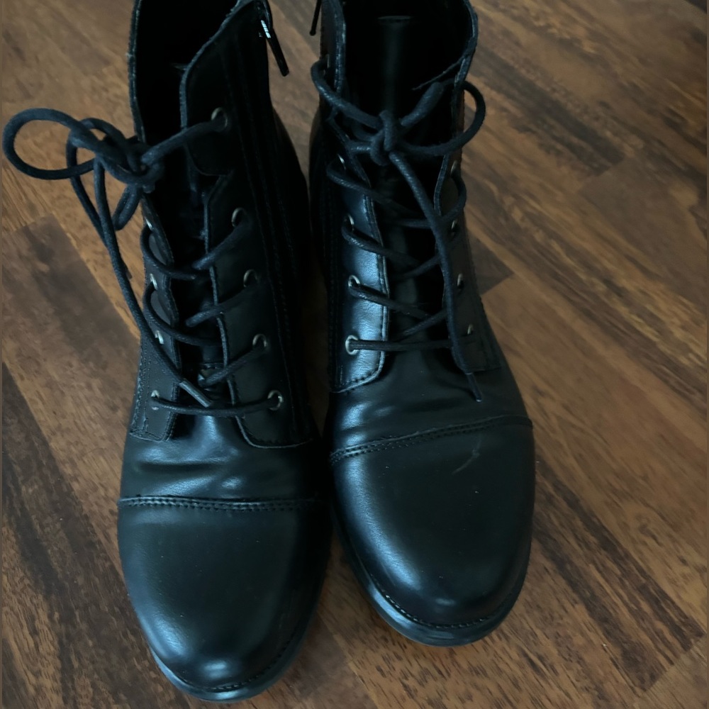 Steve Madden black combat boots size 9.5.  A few small visible scuffs.